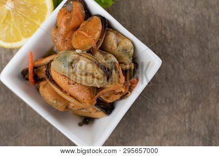 Pickled Mussels With Carrot, Lemon Juice And Oil.