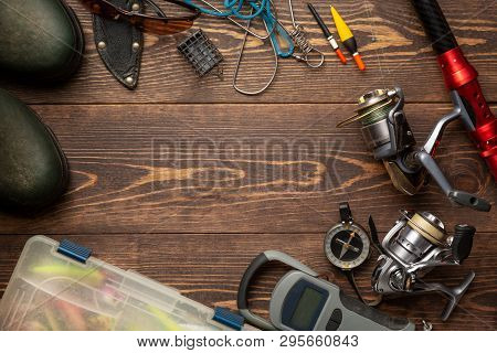 Fishing Theme. Frame With Rubber Boots, Fishing Box, Reels, Fishing Buoy, Rod, Compass, Feeder, Knif