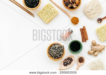 Chinese And Japanese Food Cooking With Ginger, Spices And Noodles On White Background Top View Mocku
