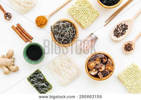 Chinese And Japanese Food Cooking With Ginger, Spices And Noodles On White Background Top View Geome