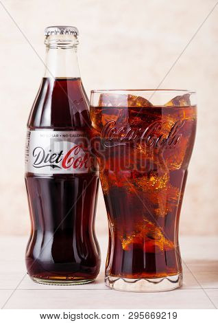London, Uk - August 03, 2018: Glass Bottle And Original Glass Of Diet Coke Coca Cola Soft Drink On W