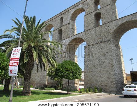Ancient Roman Aqueduct. View On Aqueduct Kamares In The Macedonia, Greece, Europe. Traveling Concept