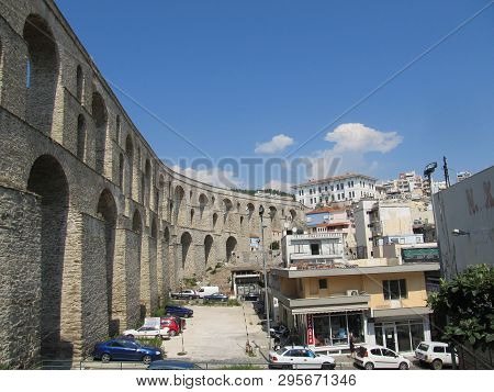 Ancient Roman Aqueduct. View On Aqueduct Kamares In The Macedonia. Traveling Concept Background. Cre
