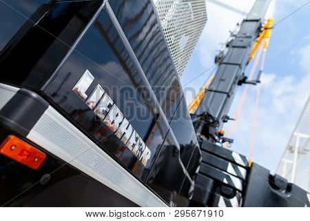 Munich / Germany - April 14, 2019: Liebherr Logo On A Black Crane At A Liebherr Machine Dealer.