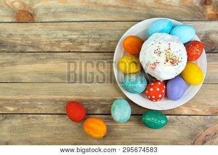 Happy Easter Card. Colorful Shiny Easter Eggs Cake With White Icing And Sugar Decor On The Table Dec