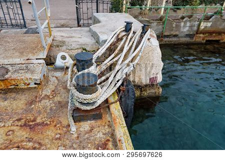 Close Up Old Bollard Or Bitts In The Dock
