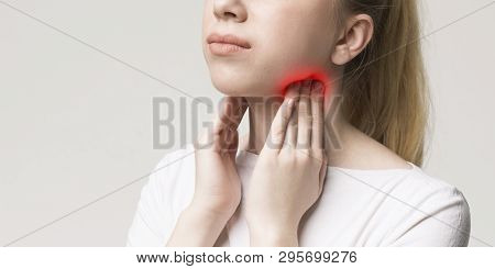 Woman With Thyroid Gland Problem, Touching Her Neck, Closeup, Panorama