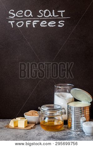 Sea Salt Caramel Candy Ingredients Near A Blackboard To Whrite The Recipe On, Copy Space For Your Te