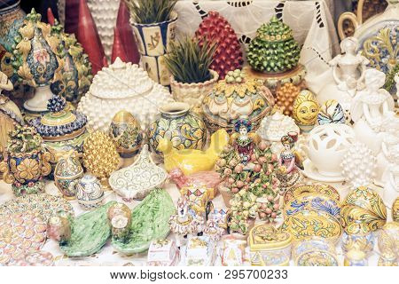 Decorative Ceramic And Glass Plates, Figurine, Vase And Statuette In The Souvenir Shop In Taormina, 