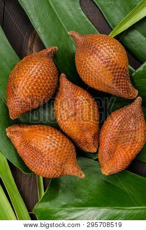 Snake Fruit, Rakum, Sala On Wood Background. Tropical Fruit.