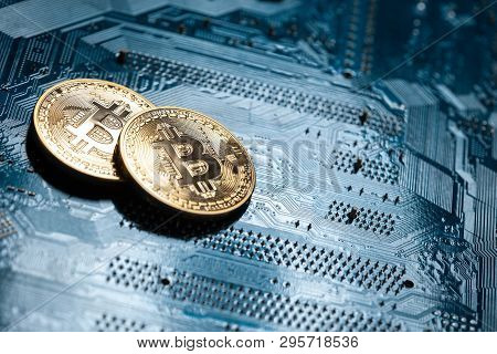 Macro Shot Of Cryptocurrency Symbol On Electronic Chip;