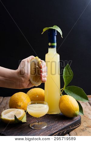 Limoncello In A Bottle And A Small Shot With Liquor. The Traditional Alcoholic Beverage Of Italy, Fr