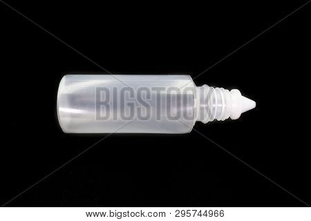 Plastic Bottle Of Normal Saline Isolated On Black Background. High Resolution Image Gallery.