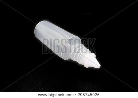 Plastic Bottle Of Normal Saline Isolated On Black Background. High Resolution Image Gallery.