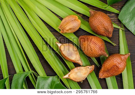 Snake Fruit, Rakum, Sala On Wood Background. Tropical Fruit.