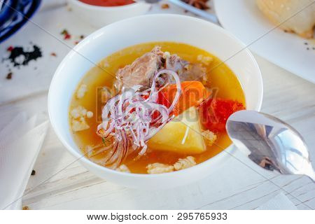 Uzbek Chorba - Soup From Fresh Meat And Vegetables On White Table, Great Image For Your Needs.