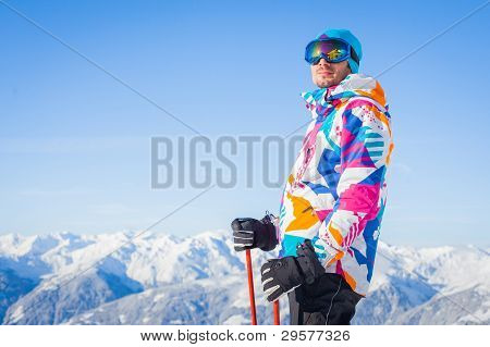 Young man with skis and a ski wear