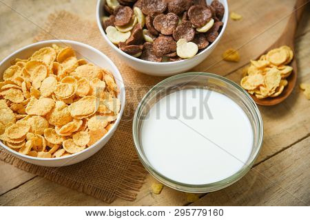 Breakfast Cornflakes And Various Cereals In Bowl And Milk Cup On Wooden Background For Cereal Health