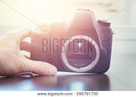 Photographer Is Using A Professional Camera, Open Sensor And Sunlight