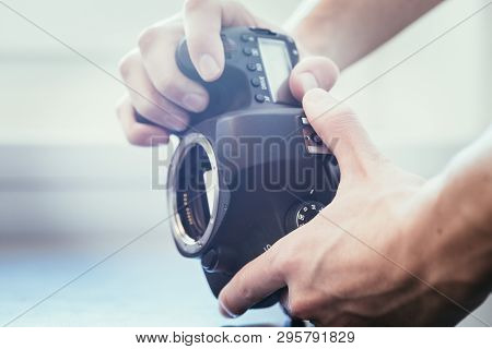 Photographer Is Using A Professional Camera, Open Sensor