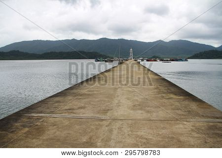 Cement Jetty Bridge Stretches To The Sea. Used For The Docking Of Ships, After Finding Out The Fish.