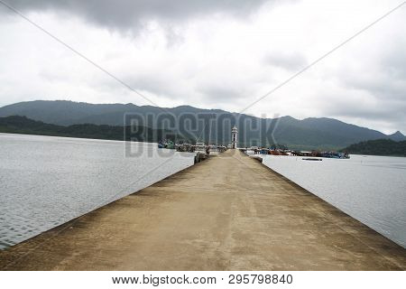 Cement Jetty Bridge Stretches To The Sea. Used For The Docking Of Ships, After Finding Out The Fish.
