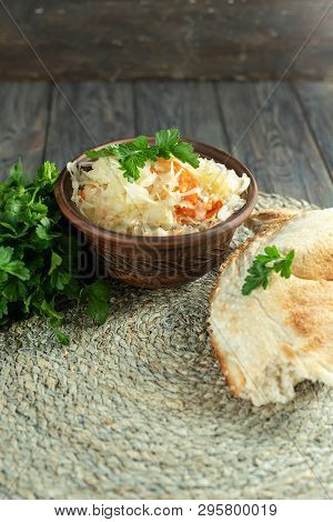 Salad Homemade Sauerkraut In A Glass Jar On A Table