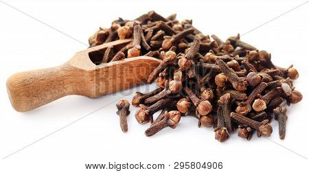 Organic Cloves In A Scoop Over White Abckground