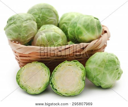 Rosenkohl Or Brussels Sprout In A Basket Isolated Over White Background
