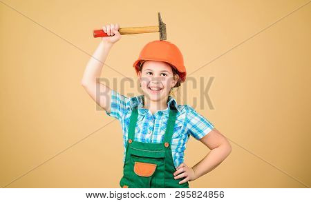 Little Girl In Helmet With Hammer. Kid Worker In Hat. Labor Day. 1 May. Foreman Inspector. Repair. S