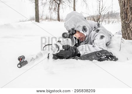 Man Soldier In The Winter On A Hunt With A Sniper Rifle In White Winter Camouflage And Equipment Lyi