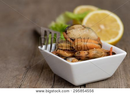 Pickled Mussels With Carrot, Lemon Juice And Oil.