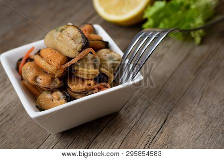 Pickled Mussels With Carrot, Lemon Juice And Oil.
