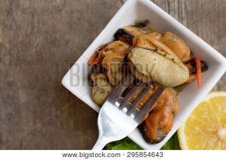 Pickled Mussels With Carrot, Lemon Juice And Oil.
