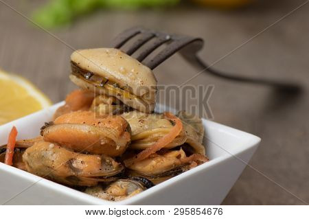 Pickled Mussels With Carrot, Lemon Juice And Oil.