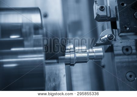 The Cnc Lathe Machine Cutting The Thread    At The Metal Parts. The Hi-technology Automotive Parts M