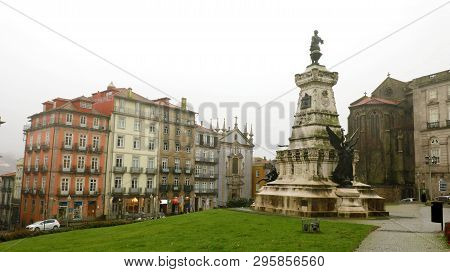 Porto, Portugal - June 21, 2018: Houses In Porto With The Infante Dom Henrique Statue, Porto, Portug