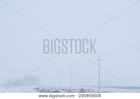 Fog Background. Gray Landscape Of Village. Pillar Near The Road