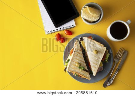 Snacks, Fast Food Concept. Eatting At Work Place. Fresh Club Sandwich, Vegetables, Coffee, Potato Ch
