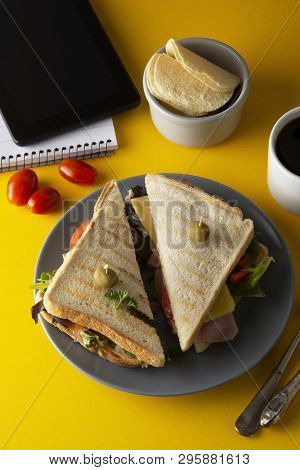 Snacks, Fast Food Concept. Eatting At Work Place. Fresh Club Sandwich, Vegetables, Coffee, Potato Ch