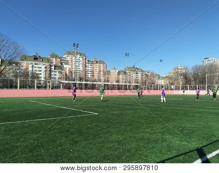 Moscow, Rf- March 26, 2019: Student Football Match On The Field With Artificial Turf, In The Backgro