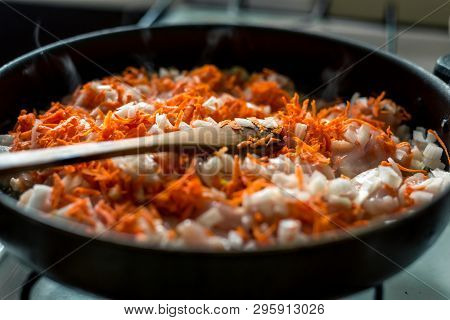 Cooking For Soup, Chopped Carrots And Onions Are Fried In A Pan