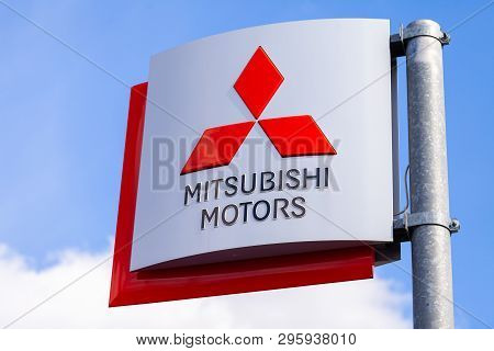 Nuremberg / Germany - April 7, 2019: Mitsubishi Logo On A Mitsubishi Flag At A Car Dealer. Mitsubish