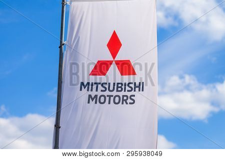 Nuremberg / Germany - April 7, 2019: Mitsubishi Logo On A Mitsubishi Flag At A Car Dealer. Mitsubish