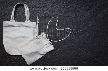 White Tote Canvas Fabric Eco Bag Cloth Shopping Sack On Dark Background / Zero Waste Use Less Plasti