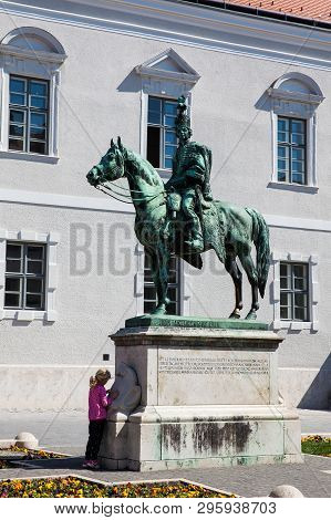 Budapest, Hungary - April, 2018: Little Girl At The Famous Statue Of Andras Hadik In Buda Castle Dis