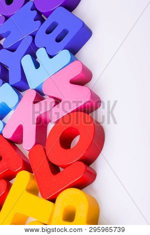 Colorful Alphabet Letter Blocks Scattered Randomly On White Background