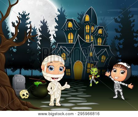 Children Celebrate A Halloween Party Outdoors At Night