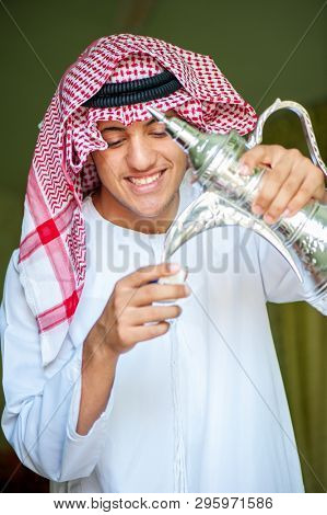 Arbic boy pouring coffee