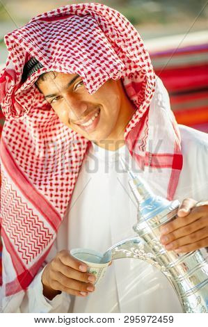 Arbic boy pouring coffee